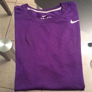 This is a beautiful DRI-fit NIKE shirt, size medium, waiting to go to the gym!